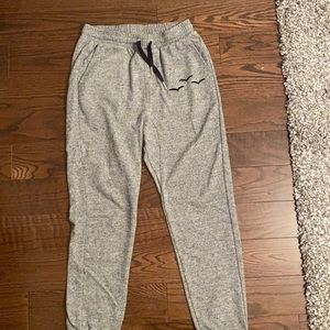 Salt and pepper grey lazy pants with black logo in size medium!